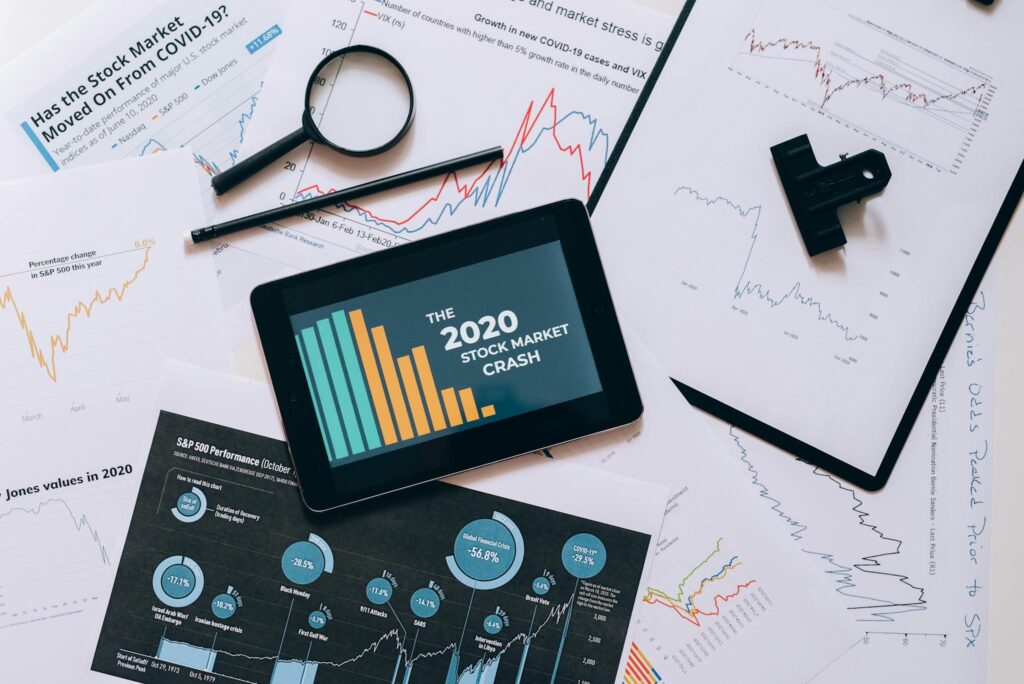 Clipboard with Statistical Data and Digital Tablet with Stock Market Display on Screen